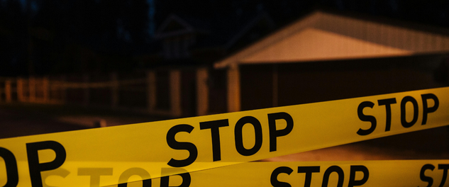 Yellow stop tape symbolizing the importance of setting boundaries for healthcare workers to protect their wellbeing
