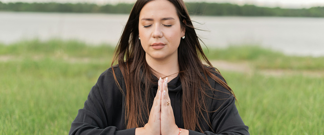 Healthcare worker practicing mindfulness outdoors to support self care and reduce burnout